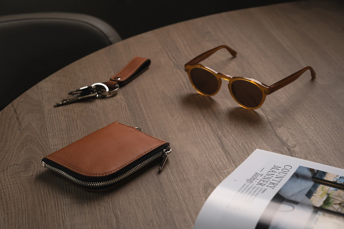 Leather accessories on a wooden table