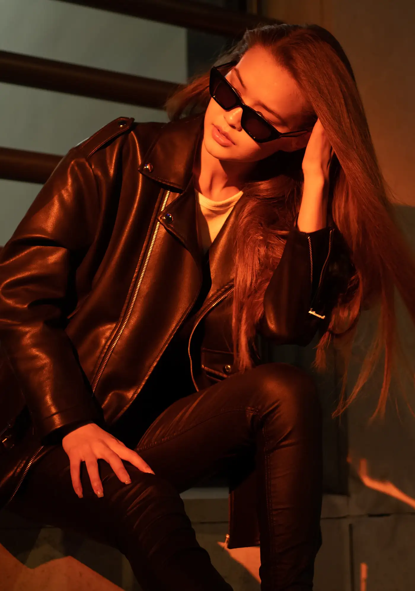 Woman in a cognac leather jacket